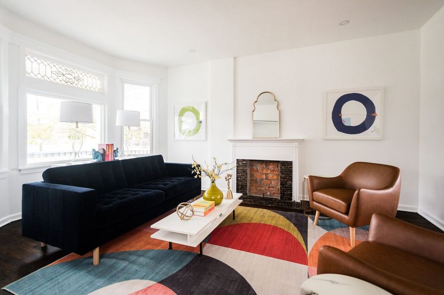 Living room with fireplace after rehab, Detroit