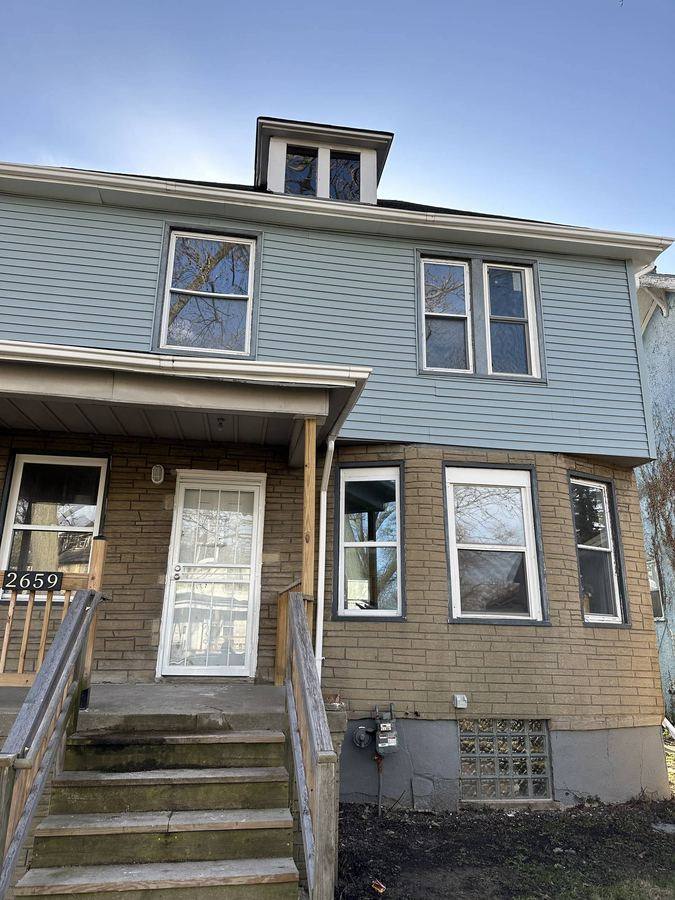 House exterior before rehab, Detroit